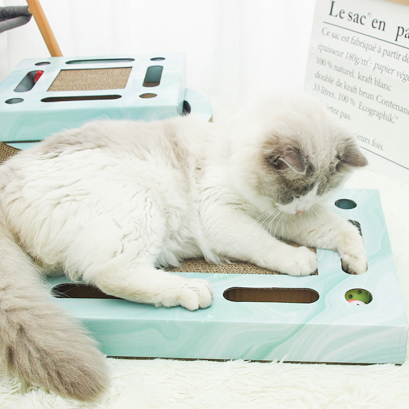 PawPuzzle™ interactive cat scratch and play board with rolling balls and scratching surface.