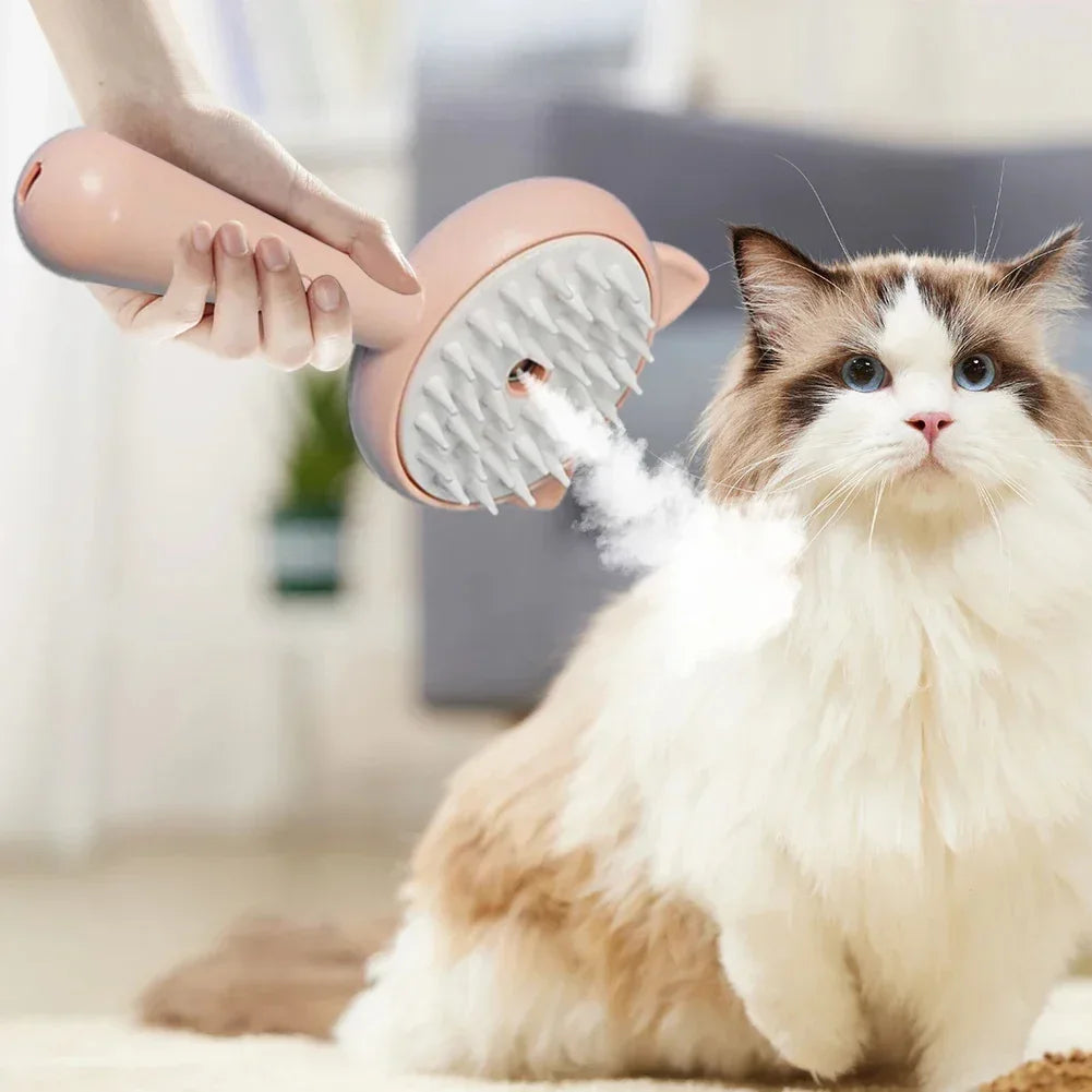 Pink cat grooming brush with mist feature gently brushing fluffy Ragdoll cat at home